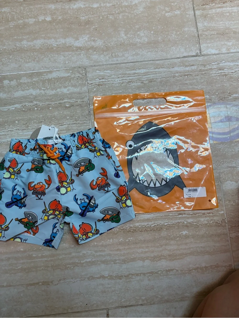 Stella McCartney Kids Light Blue Crab Print Swim Shorts with Orange Drawstring